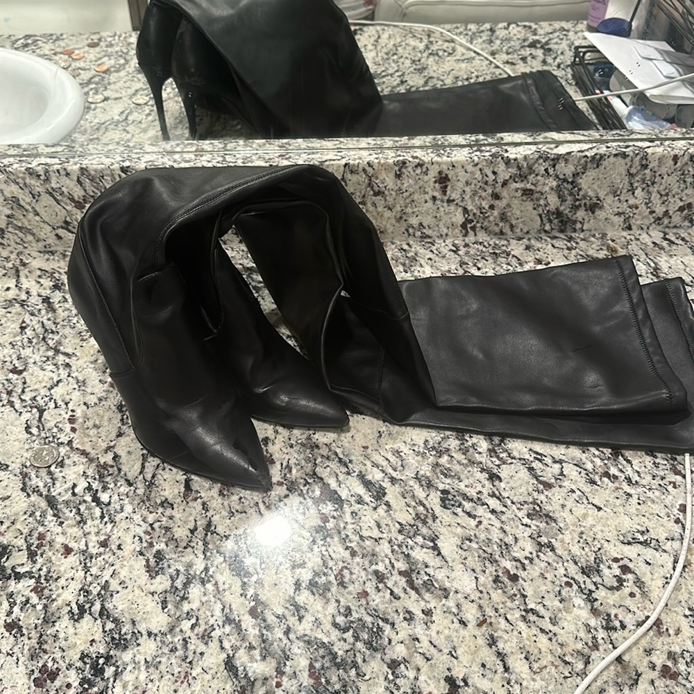 Black thought high boots not in their best condition